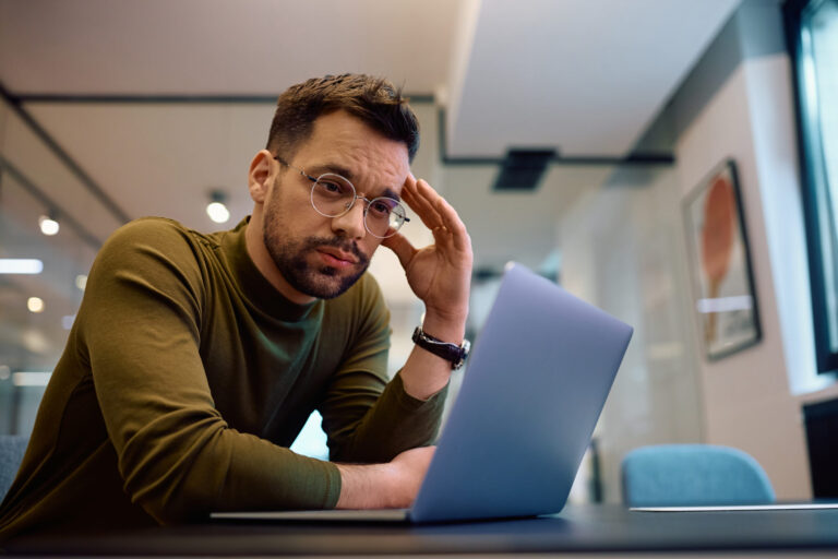 Businessman dealing with email notifications - learn to manage with Domain Systems.
